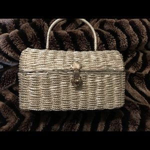 Women’s silver holiday woven hand bag.